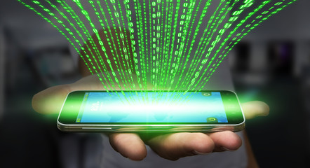 Businessman downloading software on his mobile phone