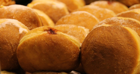 Rows of Freshly Baked Sweet Jam Doughnuts.
