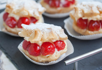 Cream Puffs with strawberries, selective focus