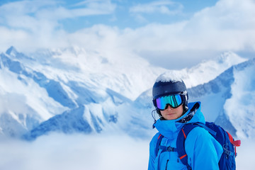 Fototapeta na wymiar Young adult in a ski helmet and goggle