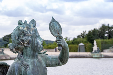 Fototapeta na wymiar Bronze Sculpture in Garden at Palace of Versailles