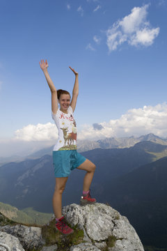 Happy Woman Reached Summit With Raised Hands In The Air