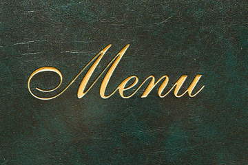 Menu cover in a restaurant with the word "Menu"