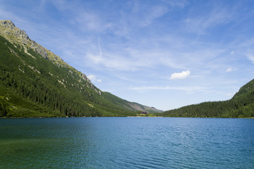 Mountain lake with blue water in a valley