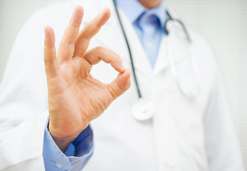 doctor showing ok sign, concept of healty man or trusting a doct