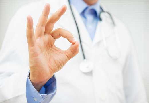 doctor showing ok sign, concept of healty man or trusting a doct