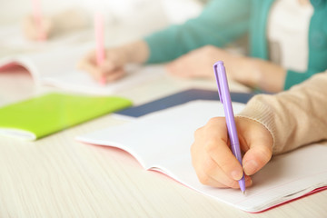 Hands of students at school, close up