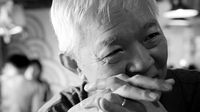 Asian senior guy talking happy 
