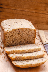 Sliced whole wheat bread on cutting board