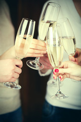 Woman hands with glasses of champagne