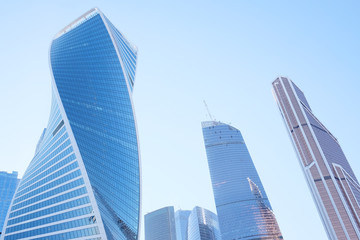 Fototapeta na wymiar Bottom view of modern skyscrapers in business district