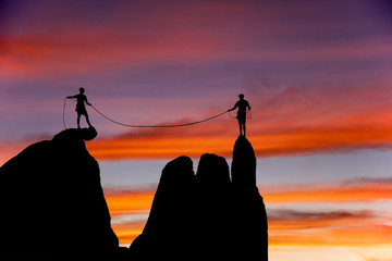Climbing team on the edge.