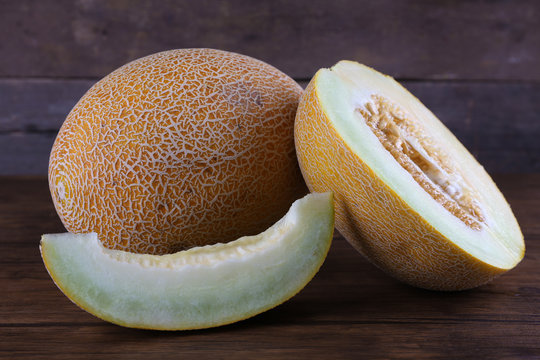 Ripe melon on wooden background