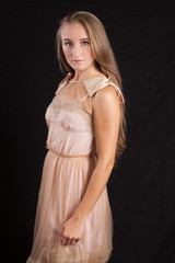 Fototapeta premium Pretty girl with long hair, looking thoughtful