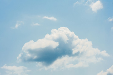 Naklejka na ściany i meble White cloud on the blue sky