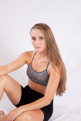 Naklejka premium Pretty long haired woman sitting thoughtfully