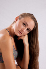 Obraz premium Pretty long haired woman looking thoughtful