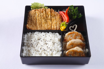 Bento set of Deep fried pork (Tonkatsu), Gyoza, Japanese rice, i