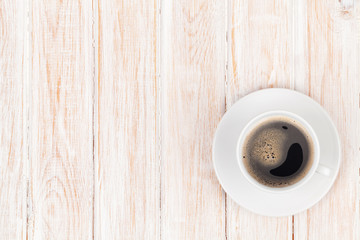 Coffee cup on white wooden table