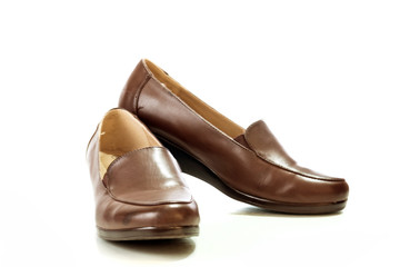 Female brown leather beautiful shoes isolated on a white backgro