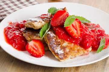 Pancakes with strawberry jam.