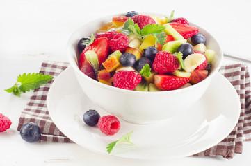 Healthy salad with fresh fruits and berries.