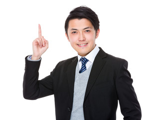 Asian young businessman with finger point up