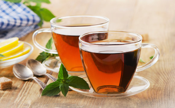 Fototapeta Cups of tea with mint leaves.
