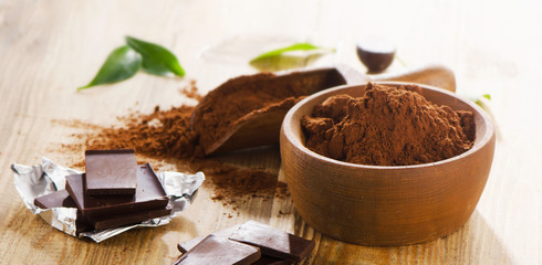 Chocolate bars and bowl of cacao powder.