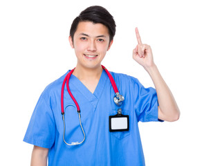 Young doctor with finger point up