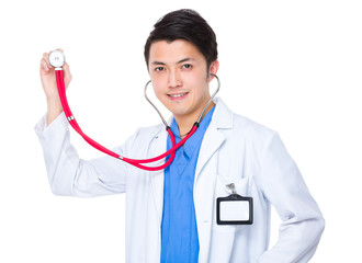Asian young doctor holding up with stethoscope