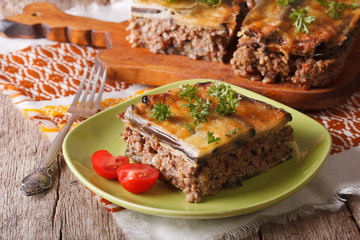 Greek moussaka with eggplant on a table close-up. horizontal
