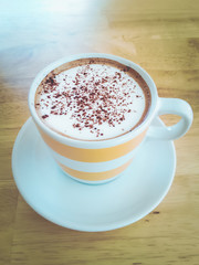 hot mocha coffee on wood table vintage tone