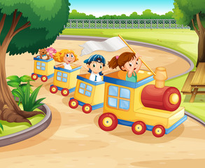 Children riding on the train in the park