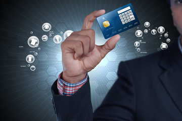 Business man showing credit card in color background