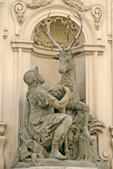 Fototapeta na wymiar At Golden deer - a baroque decoration on a house in Prague, Czech republic