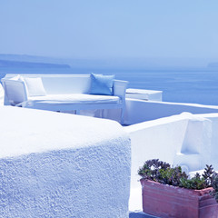 Fototapeta na wymiar The sea view terrace with white sofa, Santorini, Greece