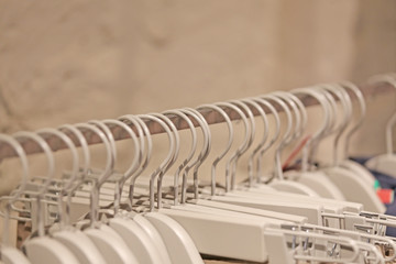 series of coat hangers in a clothes shop