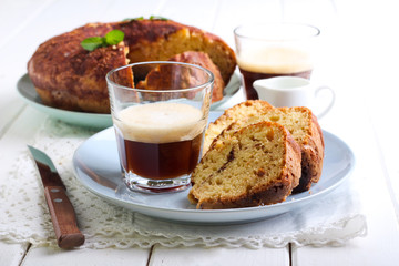 Slices of coffee cake and glass