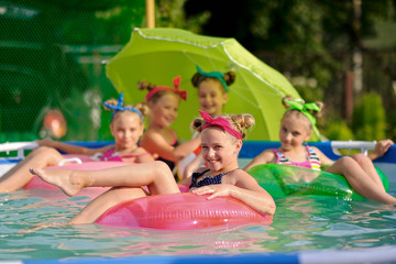Portrait of children on the pool in summer