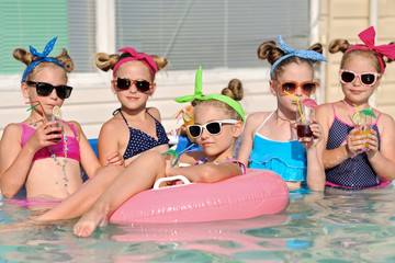 Portrait of children on the pool in summer