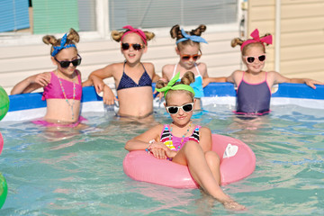 Portrait of children on the pool in summer