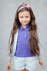 portrait of little girl outdoors in summer