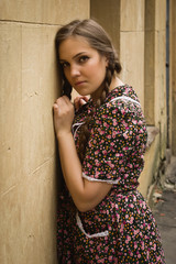 Fototapeta premium Soviet girl in retro style is on the Moscow street