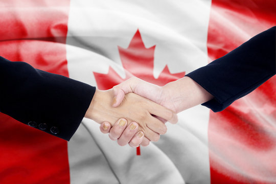 Handshake With Canada Flag Background