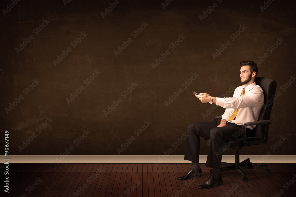 Wall mural Businessman holding high tech tablet on background with copyspac