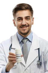 Doctor holding bottle with medical cannabis close up