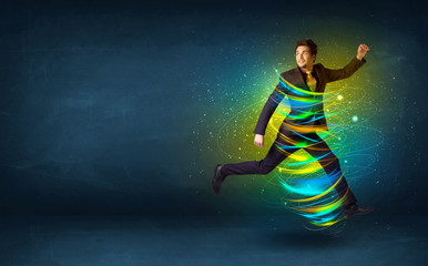 Fototapeta na wymiar Excited business man jumping with energy colourful lines