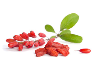  barberries near goji berries heap isolated on white background