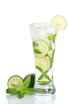 glass of ice water with lemon and mint on white background